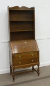Early 20th Century medium oak two drawer bureau with open bookcase top