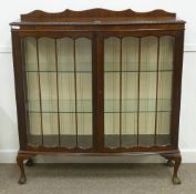 Early 20th Century walnut bow front display cabinet