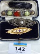 Victorian bar brooch set with amethyst and seed pearls stamped 9 carat and jet brooch; Miracle