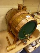 Oak brass bound whiskey barrel on stand with measures etc