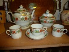 English porcelain tea pot, matching stand, sucrier, tea cup, saucer and two coffee cans pattern