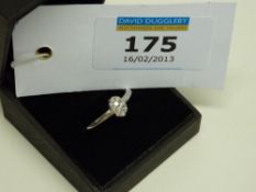 Hallmarked 9ct white gold ring with oval set diamonds
