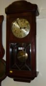 Early 20th Century mahogany cased wall clock with chiming movement bevelled glass panel door