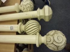 Four similar wooden curtain poles in ivory washed finish