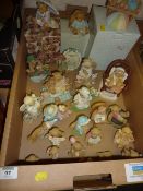 Collection of Cherished Teddies sculptures in a box and a basket