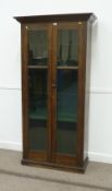 Edwardian walnut bookcase display cabinet enclosed by two glazed doors