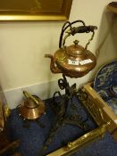 Two Edwardian copper Gypsy kettles on wrought iron stands