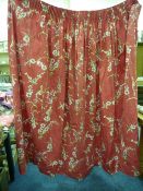 Pair of red ground floral print lined curtains 256cm x 161cm drop and matching pelmet 130cm