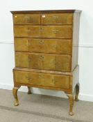 George II figured walnut chest on stand, two short above four long cross banded drawers