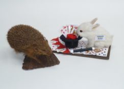 Taxidermy - hedgehog mounted on rustic bracket and a magicians rabbit