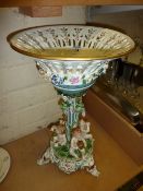 Continental porcelain centre piece decorated with cherubs and grape vine