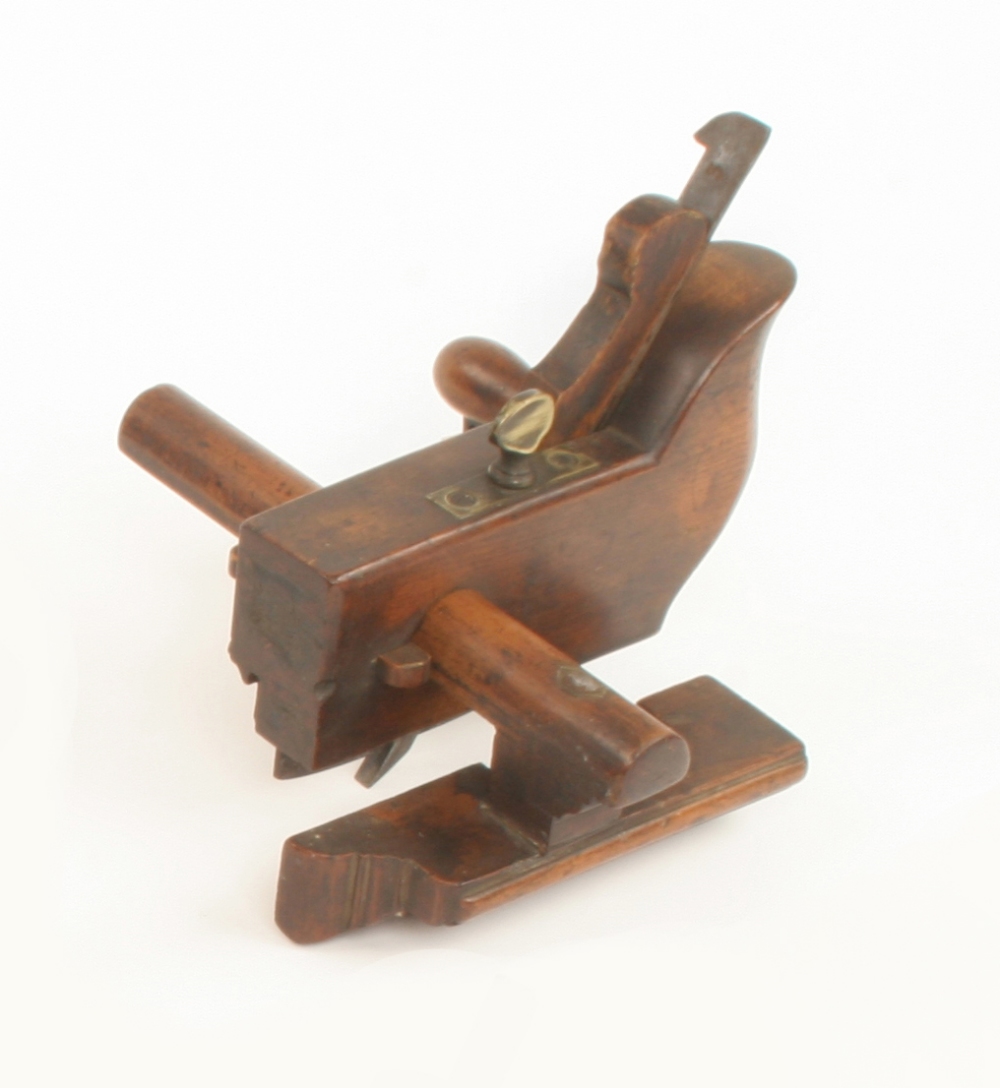 An unusual coachbuilders circular plough plane with shaped heel to form an integral handle c/w