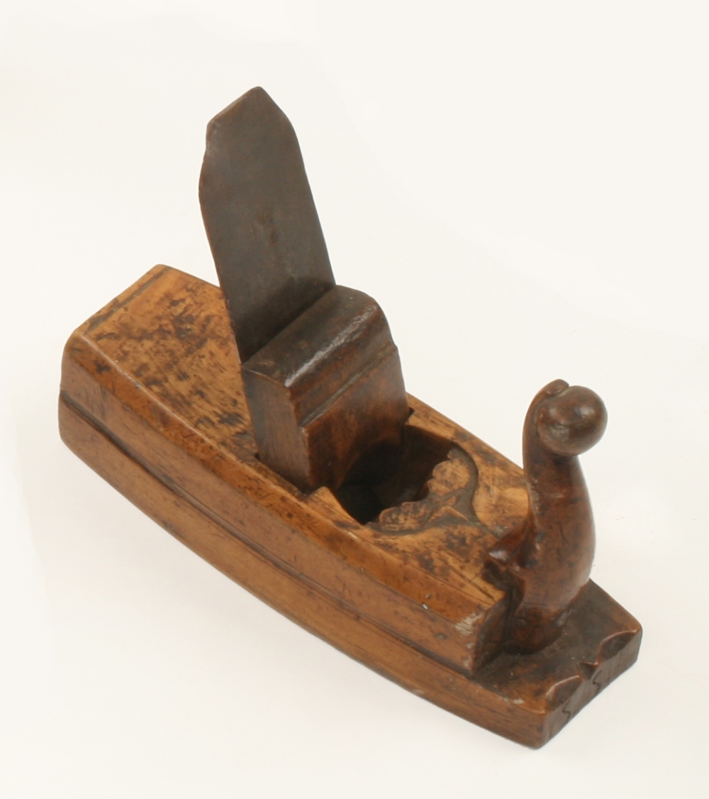 An 18c German boxwood toothing plane 6 1/2" x 2 1/4" with cupids bow decoration at escapement and