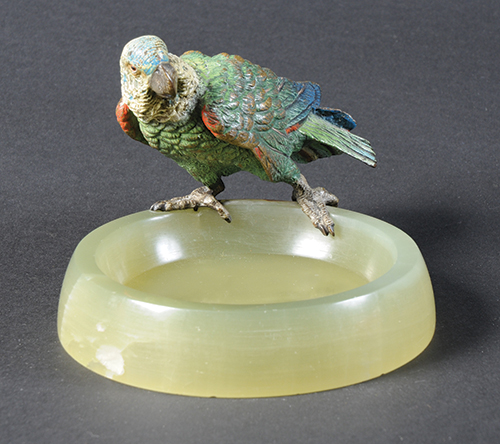A good cold painted bronze parrot perched on a green onyx ashtray, height overall 7.5cm. (See