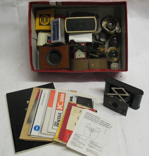 A small Kodak Autographic folding camera, and a quantity of shutters and lenses, light meters, etc