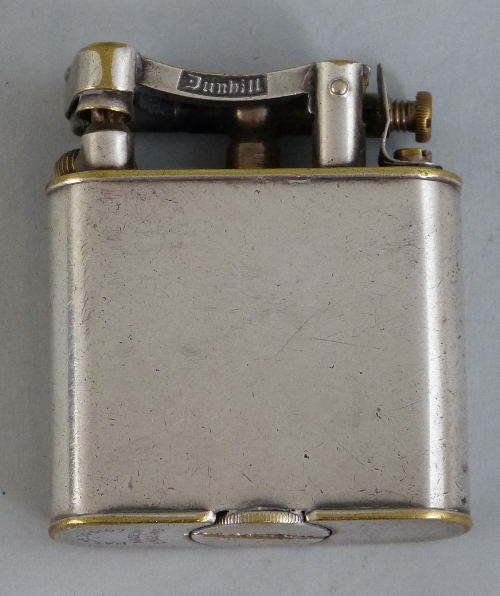 A Dunhill petrol lift arm pocket lighter, 1920`s/30`s, with silver plated on brass case, 5cm high