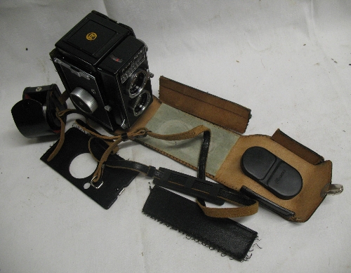 A Ricoh Auto 66 reflex camera, in leather case with lens hood