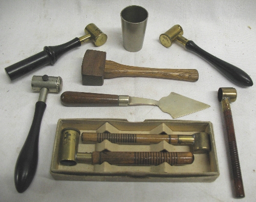 A pair of Lightwood and Son brass powder and shot measures, with turned wooden handles, boxed, three