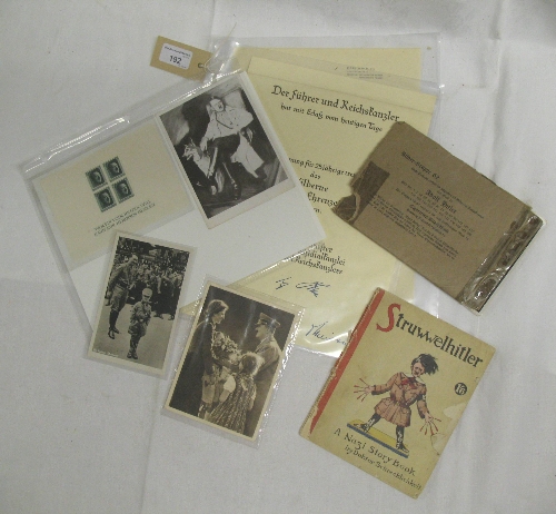 A collection of Third Reich and other items relating to Adolf Hitler, including a sheet of