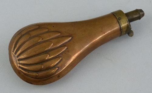 A copper and brass powder flask, of pear shaped form with part embossed body, 18.5cm long