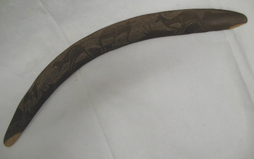 An Australian hardwood boomerang, carved with kangaroos, 60cm long