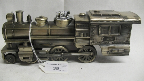 A novelty petrol table lighter, and cigarette box in the form of a diecast American style steam