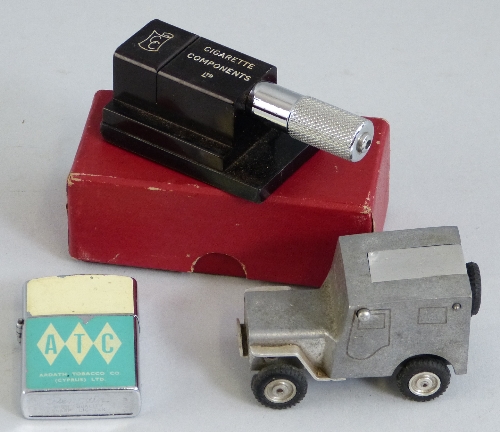 A mid 20th Century German Baier white metal Willy`s jeep cigarette lighter, 7.5cm long, an Ardath