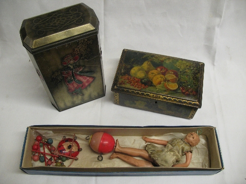 A Japanese clockwork celluloid hanging doll, 48cm high and two tins, one marked Victory-V Gums and