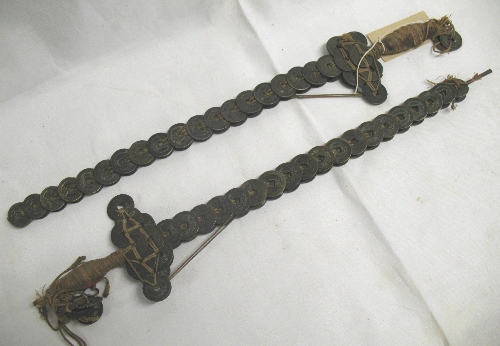 A pair of Chinese ornamental swords, each formed with a double row of threaded coins with string