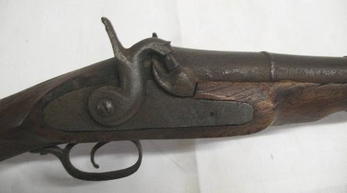 A 19th Century Arabian percussion musket, the walnut stock with chequered fore end and 109 1/2cm