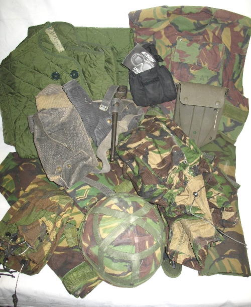 A quantity of military clothing and equipment, including a pair of ESS V12 tactical goggles, a