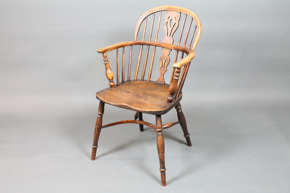 An elm, ash and yew wood high back Thames Valley Windsor  chair, circa 1840, having pierced and