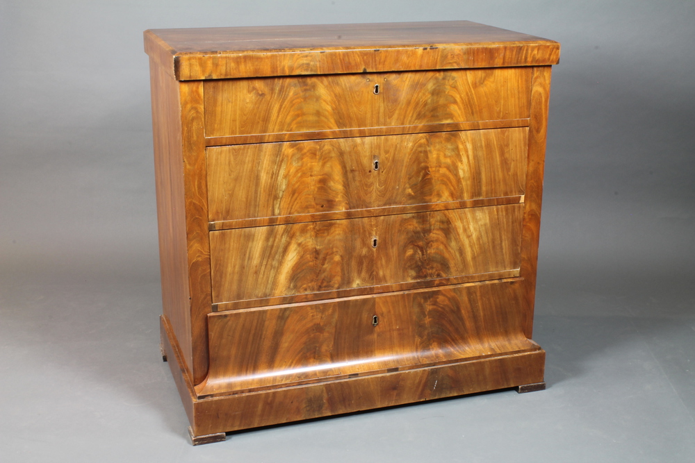 A 19th Century Biedermeier walnut commode, Alsace region, having chamfered top above 4 long drawers,