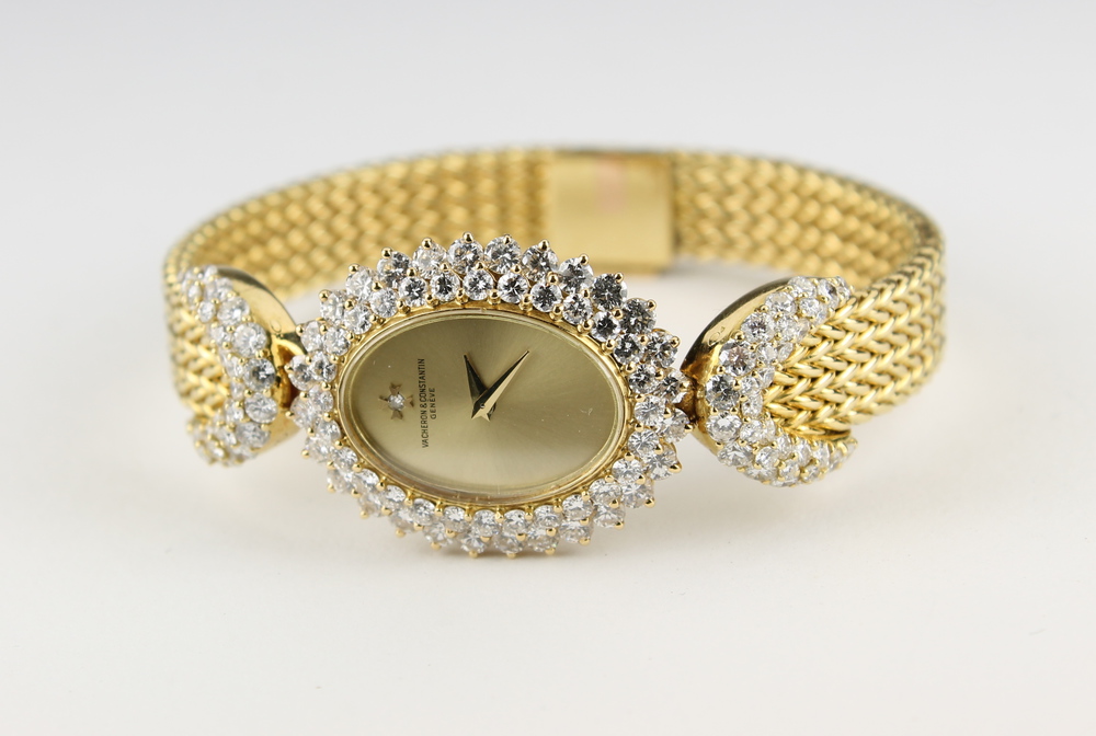 A Vacheron & Constantine lady`s gold cocktail wristwatch with  oval dial surrounded by diamonds