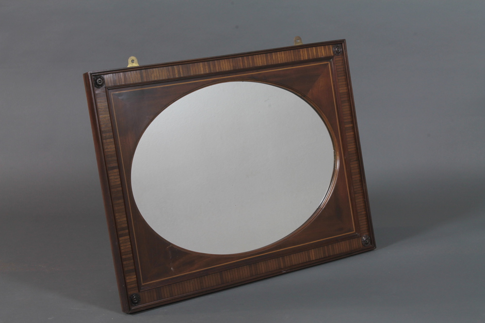 A late 19th Century rectangular wall mirror, boxwood and ebony inlaid, inset oval plate with rosette