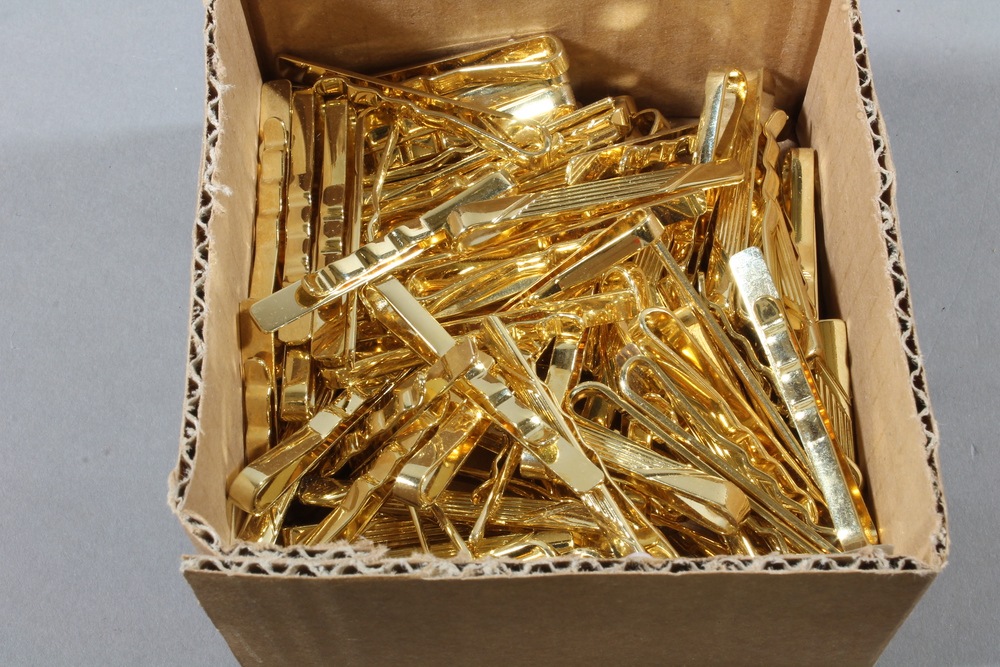 A quantity of gilt metal tie clips