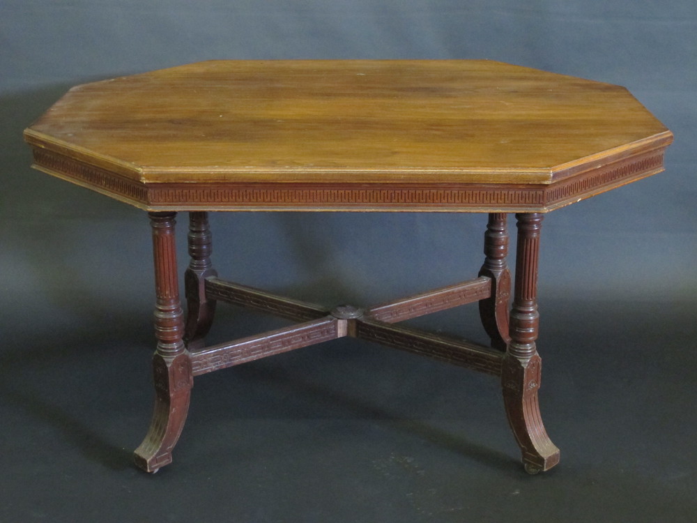 An Edwardian mahogany lozenge shaped aesthetic movement  centre table, raised on turned and reeded