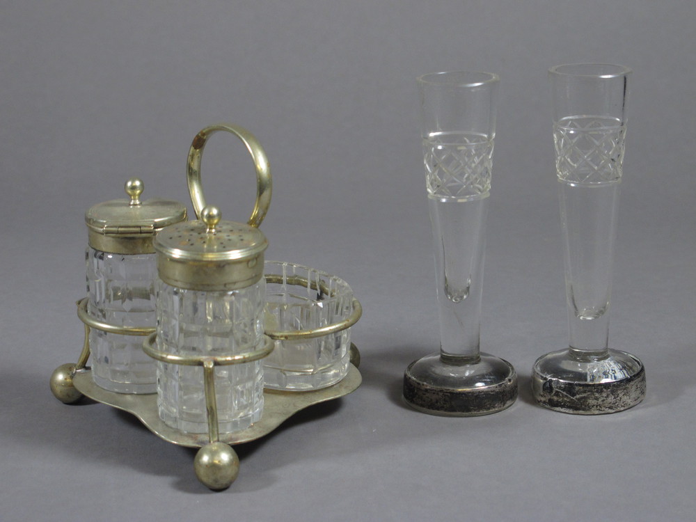 A pair of cut glass specimen vases with silver bases 5" and a 3 piece condiment set with silver