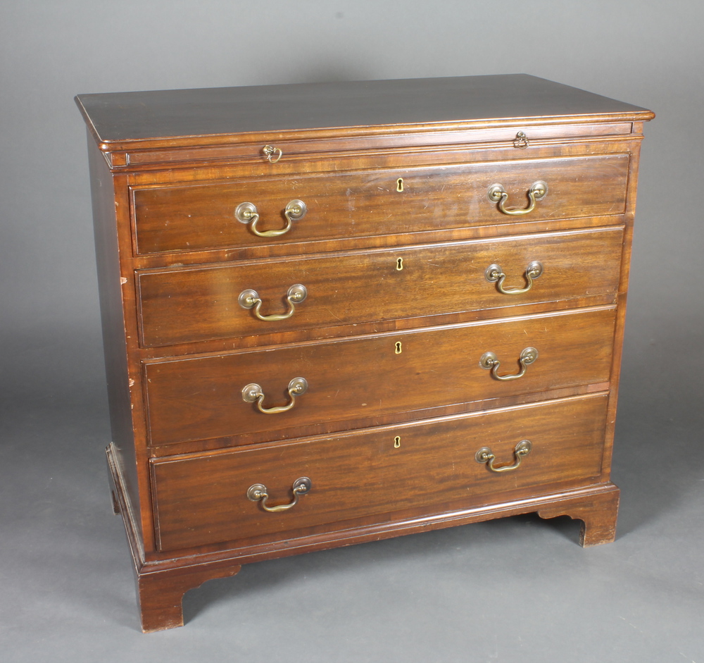 A Georgian mahogany chest fitted a brushing slide above 4 long drawers with brass swan neck handles,