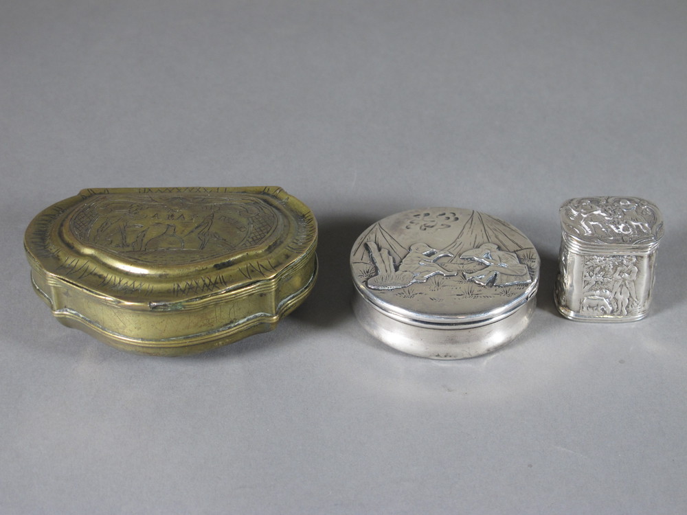 A Continental embossed white metal box with hinged lid, a  sterling circular box with hinged lid