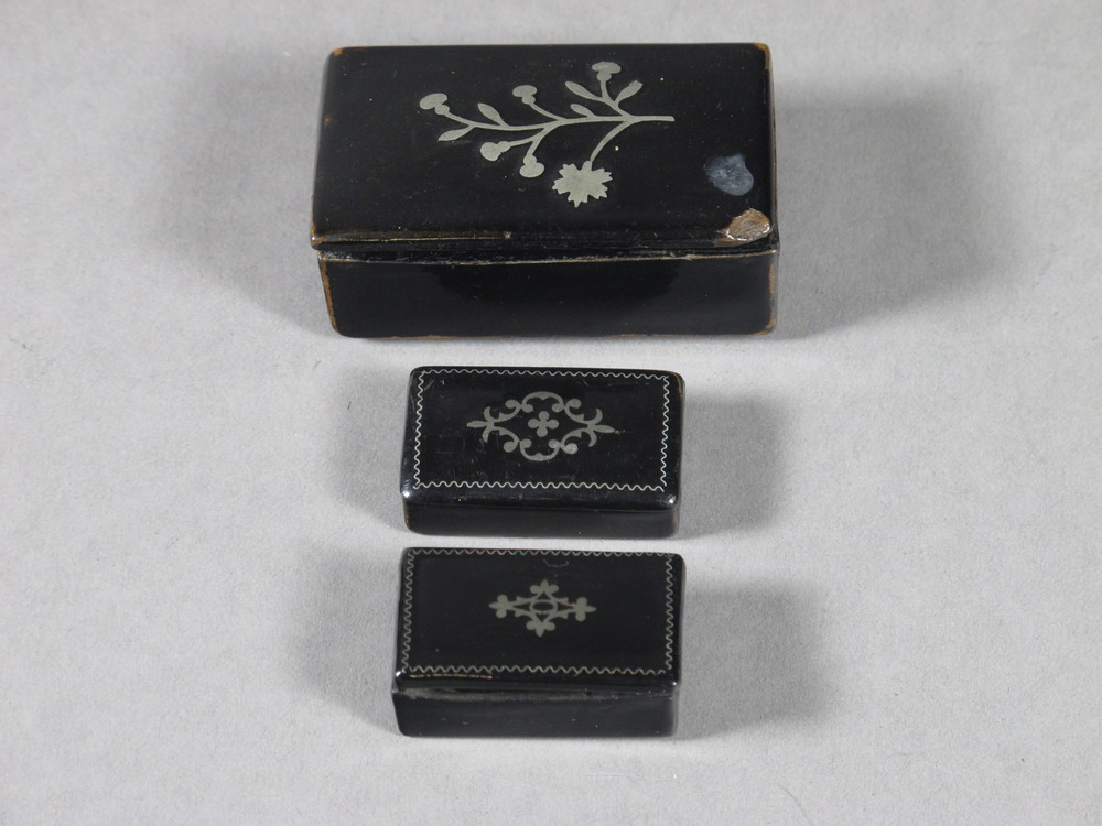 A Victorian rectangular lacquered snuff box 2 1/2" and 2 others  1 1/2"