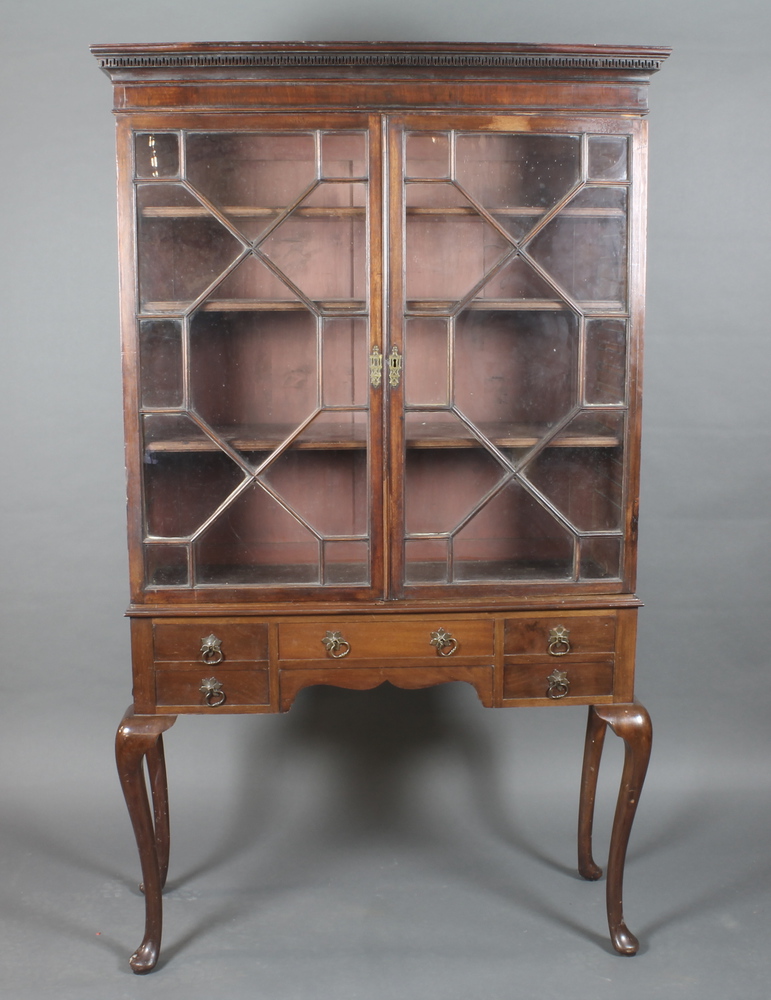 A Georgian mahogany display cabinet with moulded and Grecian  Key pattern cornice, the shelved