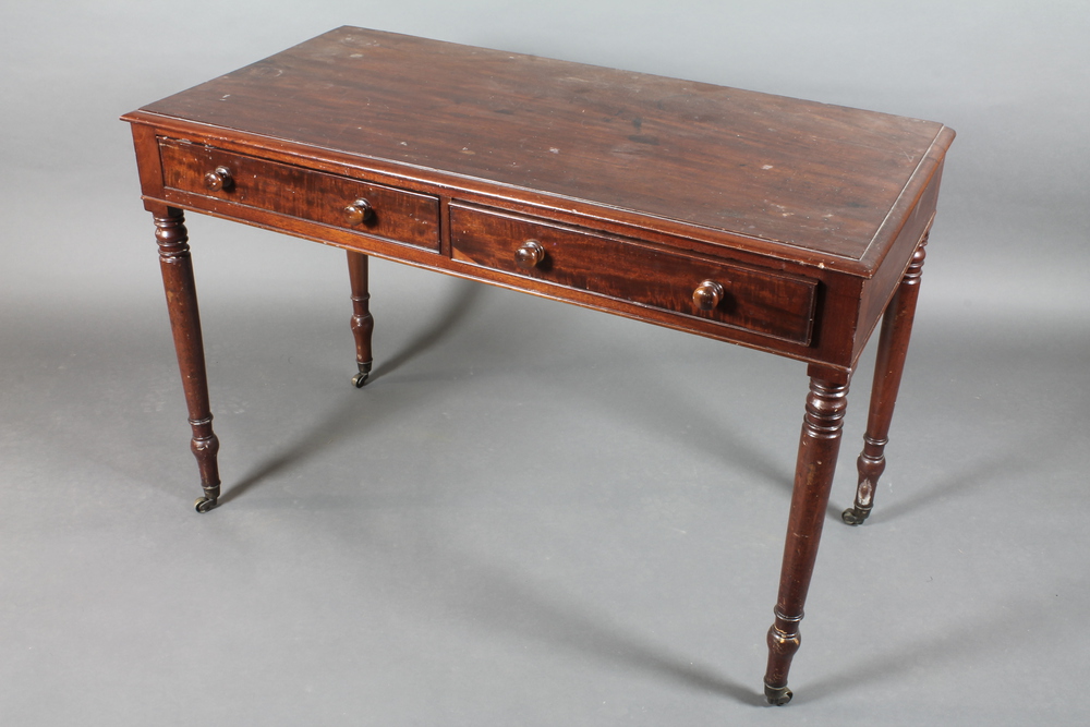 A 19th Century rectangular mahogany side table fitted 2 drawers  raised on turned supports ending in
