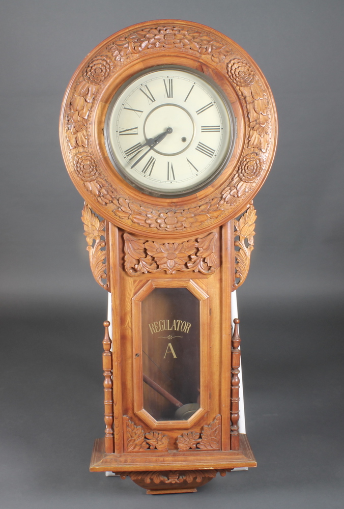 A large regulator style striking clock with 12" circular painted  dial, the door marked Regulator A,