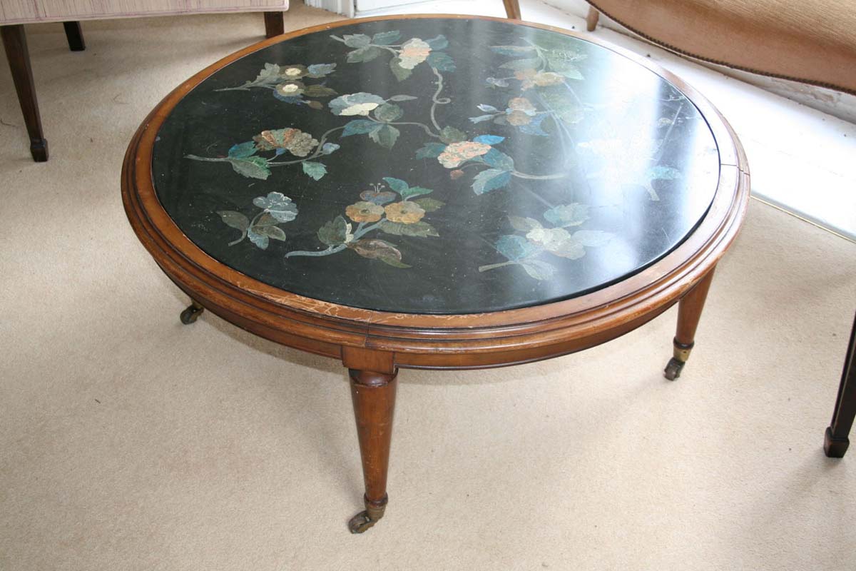 A CIRCULAR LOW TABLE, with scagliola floral marble top on tapering legs, 100 cm diameter.