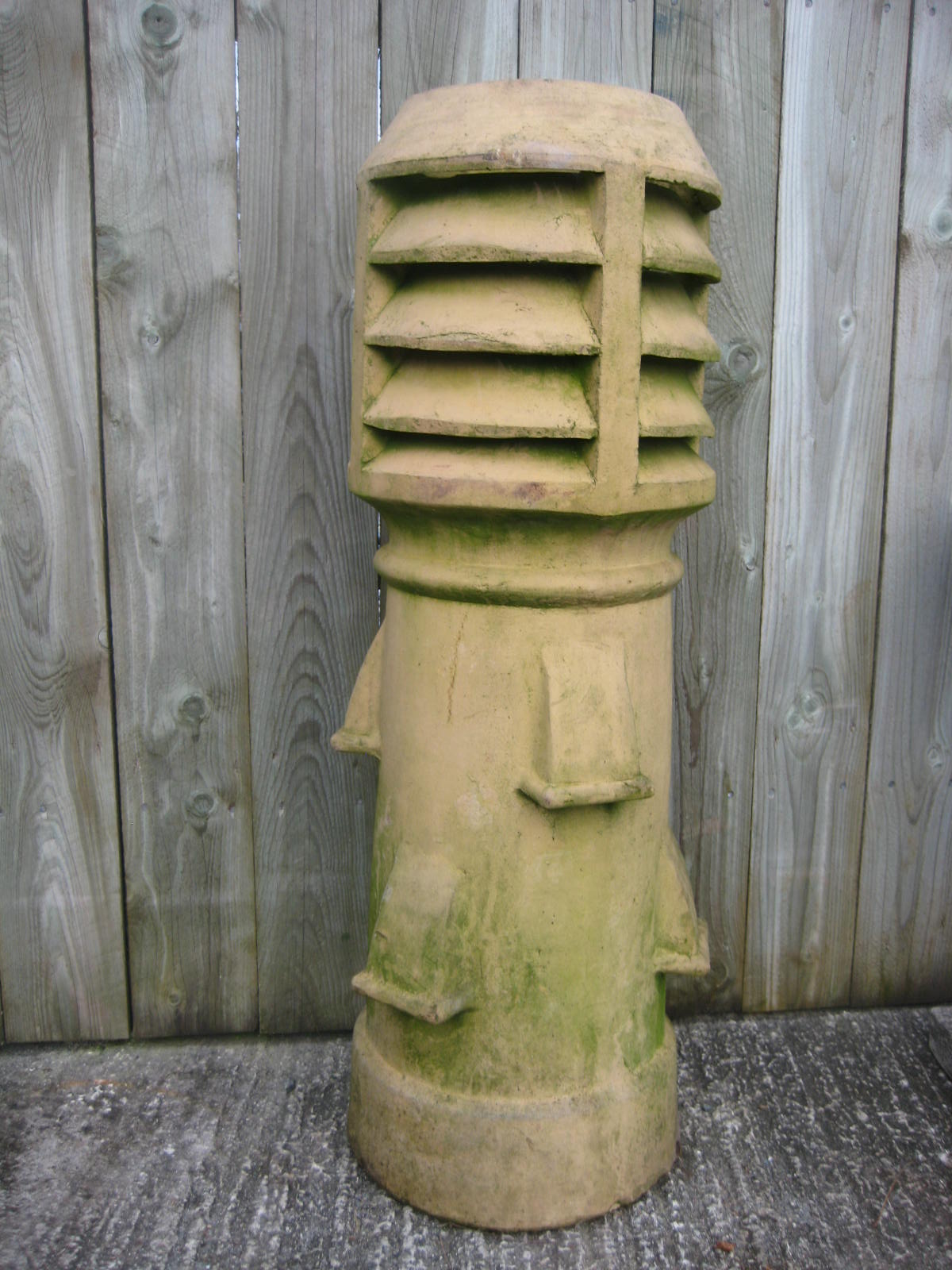 A Victorian chimney pot 110 cms high