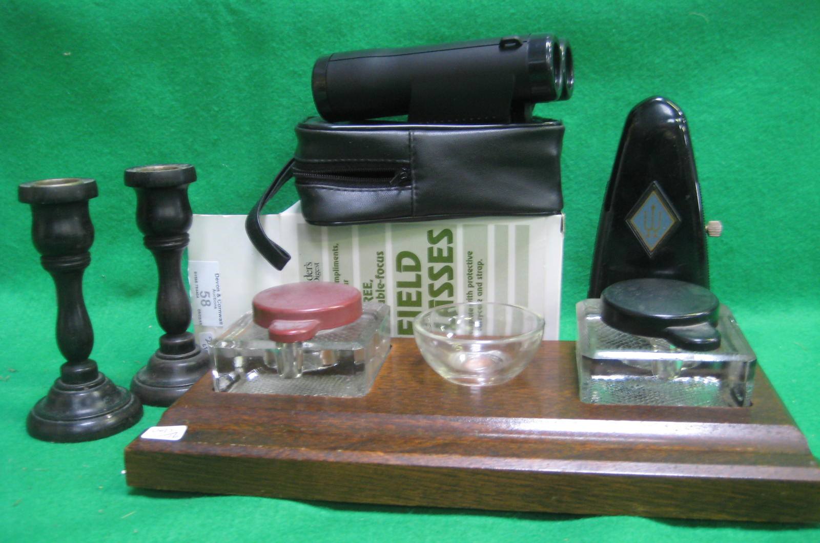 An oak inkstand, metronome, pair of candlesticks and a set of field glasses
