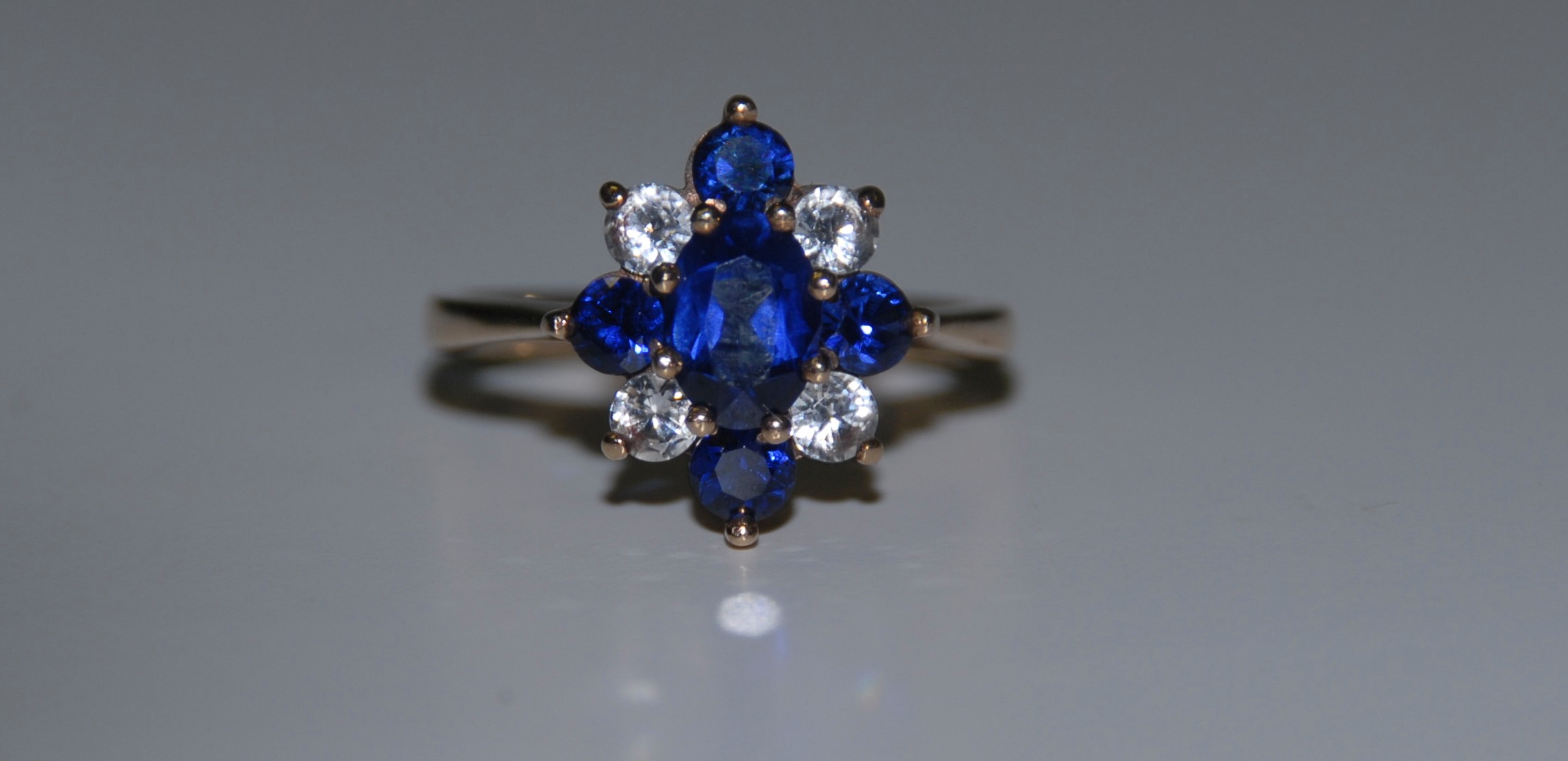 A 9ct gold blue and white stone ring