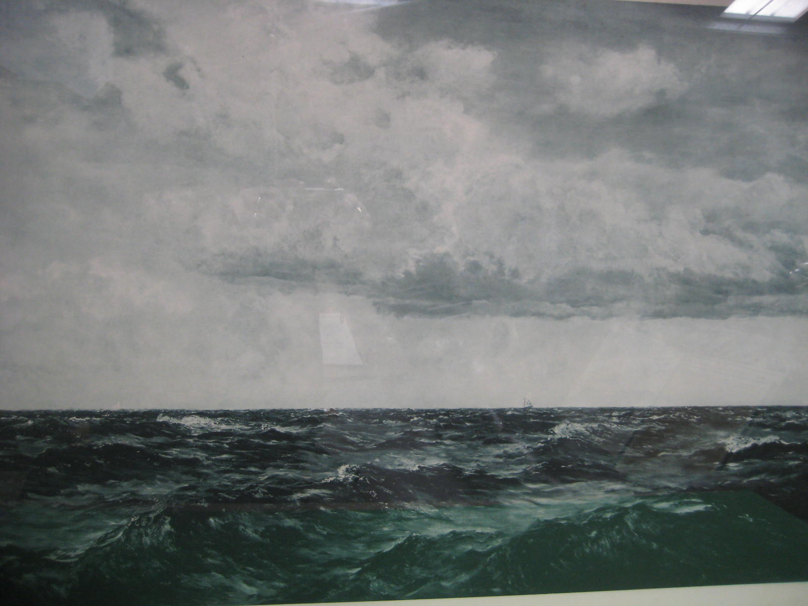 A large framed print of an extensive seascape, the mount signed in pencil Henry Moore 21 x 31 cms