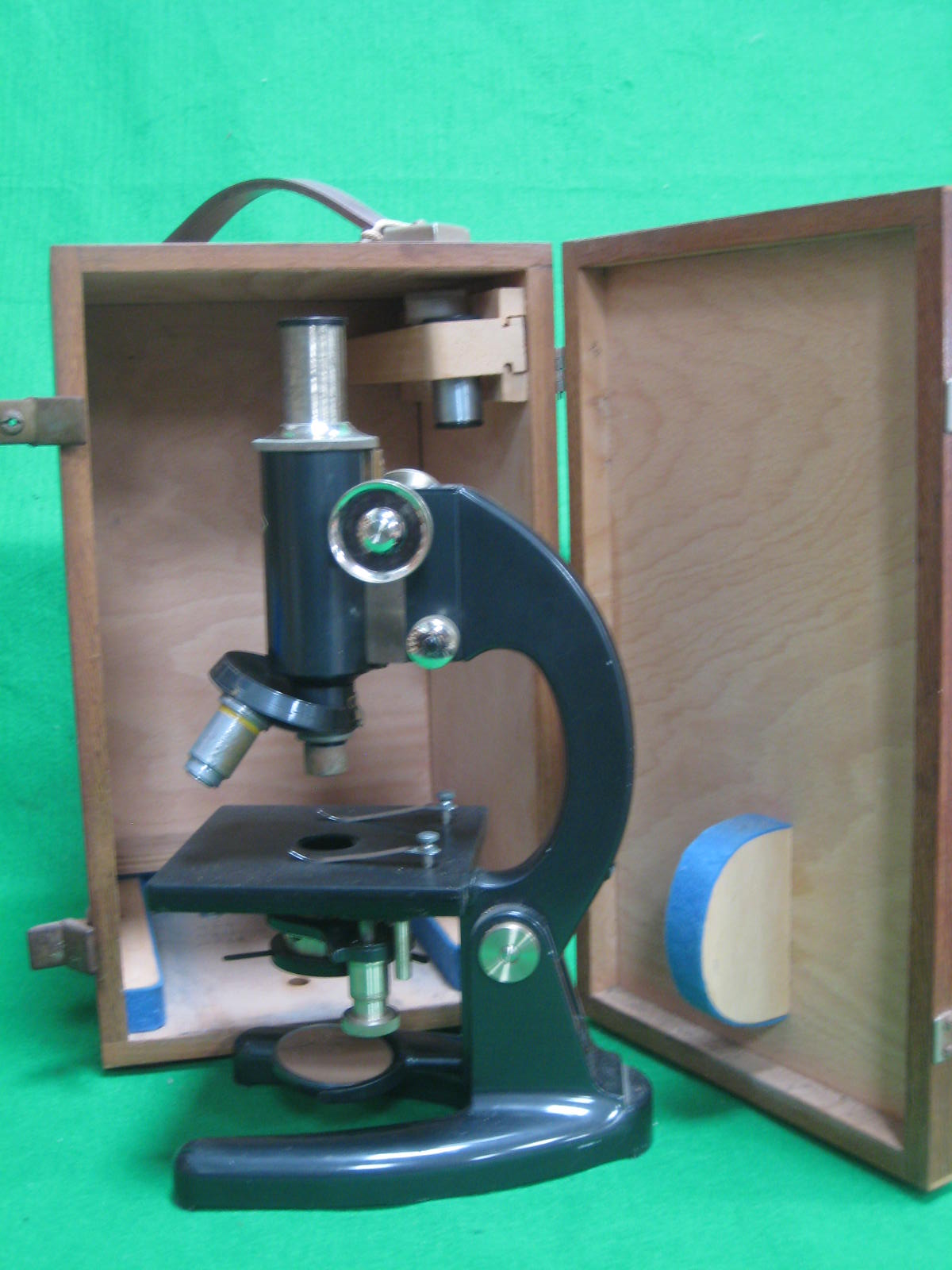 A cased Prior microscope, with spare lens